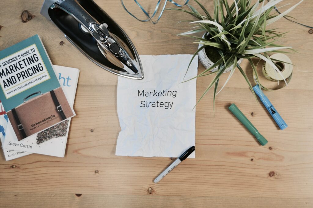marketing strategy is written on a white blank paper sheet