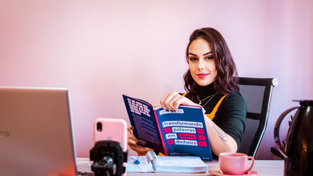 a girl holding a prospectus of marketing
