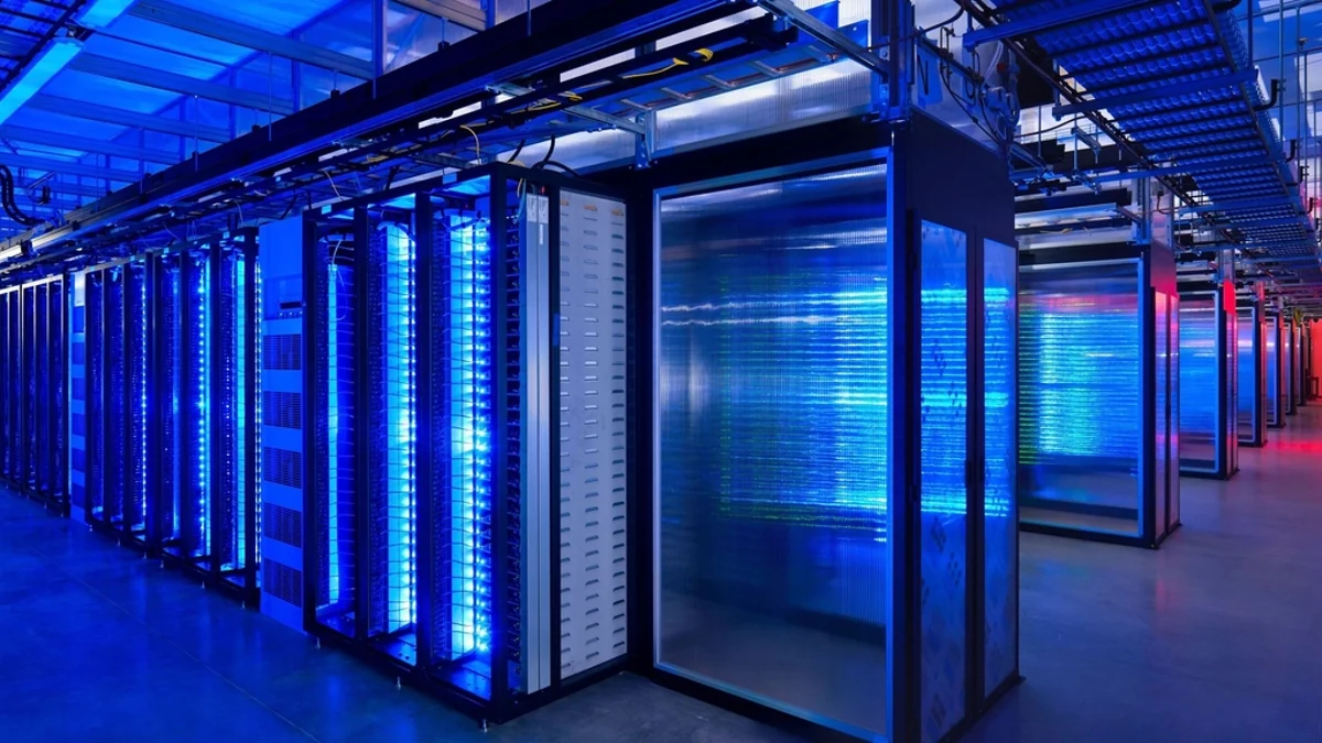 Rows of server racks lit blue in a data centre, the kind of hosting servers where PHP security updates must be installed